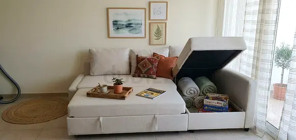 Comfortable L-shaped sofa with easy sofa-to-bed conversion, spacious chaise section, and convenient