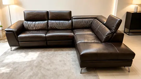 Brown leather L-shaped sectional sofa with adjustable headrests - good condition