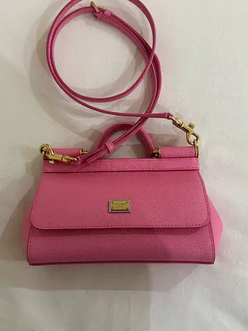 Pink structured leather top-handle bag with gold hardware