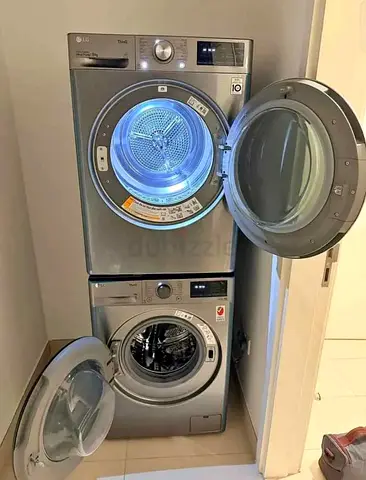 Stacked LG Washer and Dryer Set - Silver, Good Working Condition