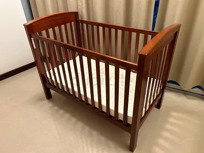 Solid wood baby crib with mattress - good condition
