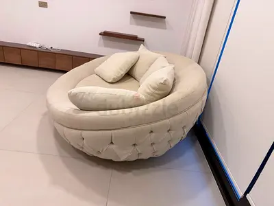 Cream round tufted swivel lounge chair - good condition