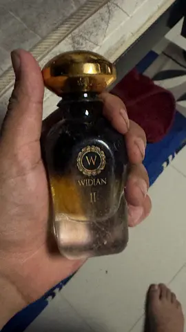 Widian II perfume bottle — partially used