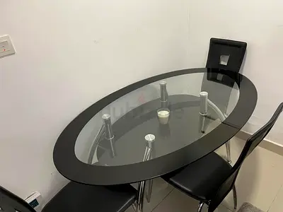 Glass Top Oval Dining Table with 3 Black Chairs - Good Condition