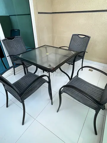 Outdoor dining set - glass top table with 4 chairs