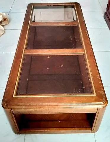 Wooden glass-top coffee table with storage shelf - used