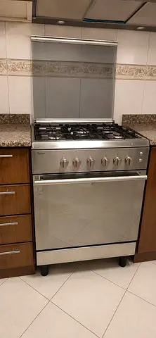 Bompany Italy Stainless Steel 4-Burner Gas Cooker with Oven and rotisserie. Good Working Condition