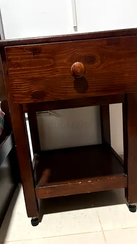 Used dark solid wood bedside table with drawer and shelf - good condition