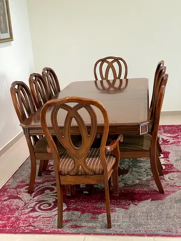 Solid wood 6-seater dining table with carved chairs