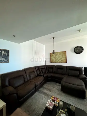 Brown leather L-shaped reclining sectional sofa - good condition