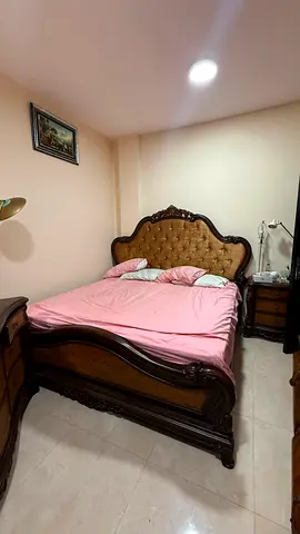 Classic Carved Wooden Bed with Tufted Headboard and Nightstands