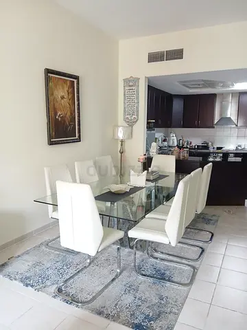 Modern 8 Seater Glass Top Dining Set with White Leatherette Chairs
