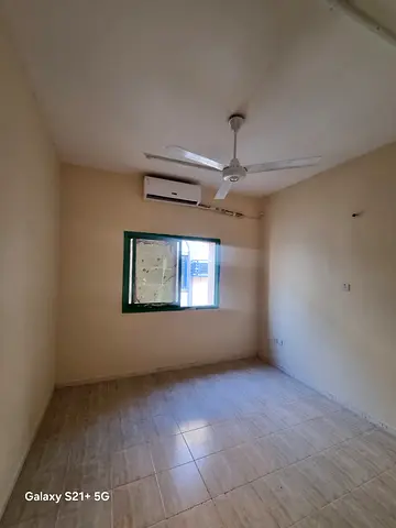 For rent in Al Nasserya, Sharjah: 2-bedroom apartment opposite the park, 1 bathroom, split AC, prime location. AED 28,000/year, 4 payments, AED 3,000