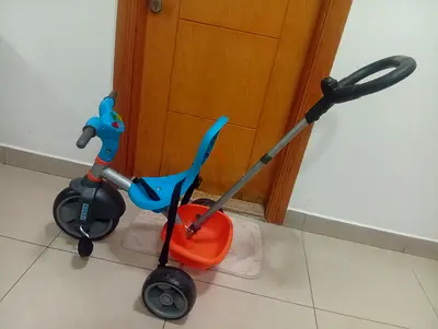 Used toddler tricycle with parental push handle - good condition