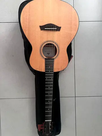 Used acoustic guitar with soft case - brand new condition