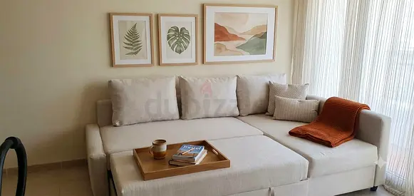 Modern living room sofa bed with a practical L-shaped design, comfortable mattress area, spacious st