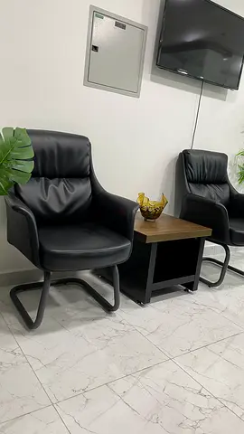 Black leather lounge armchair — comfortable single seat