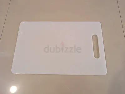 White plastic cutting board with handle - good condition