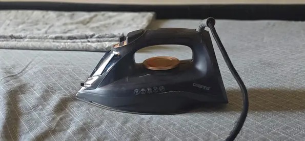 Used Black Steam Iron in Good Working Condition