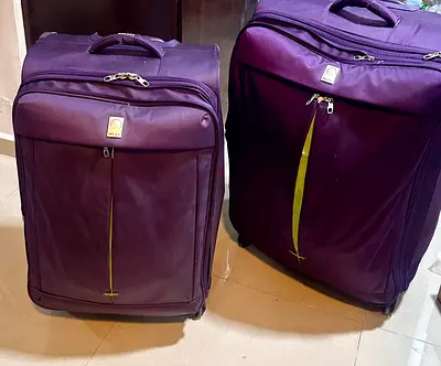 Delsey 2 purple soft-shell roller suitcases set - medium and large, used
