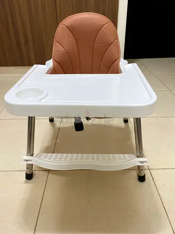 Used baby high chair with tray and footrest - clean and sturdy