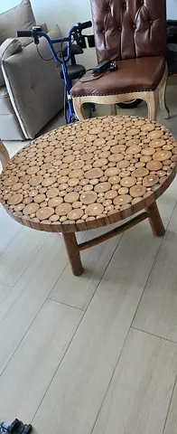 Round wooden coffee table with log slice mosaic top - sturdy and unique
