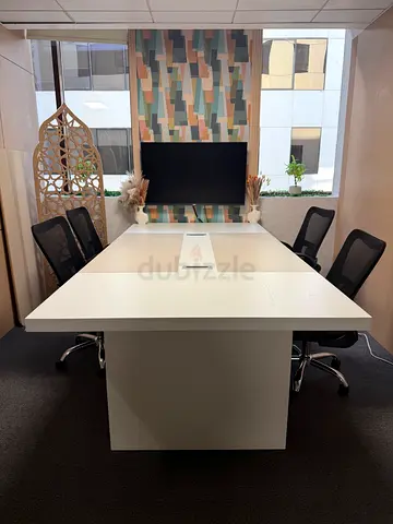 White modern meeting table with 6 office chairs