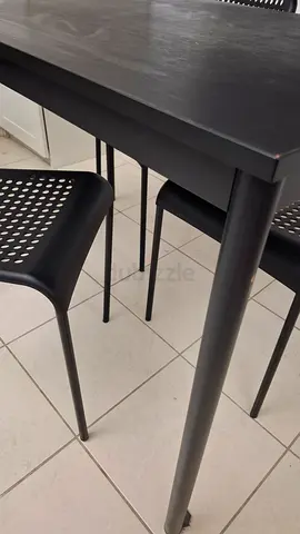 Modern black dining table with matching chairs - set of 3