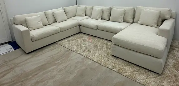 Beige color cratebarrel Ushape sofa