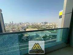 Two bedrooms and a living room with a balcony overlooking Grand Mall and Sheikh's Palace in City