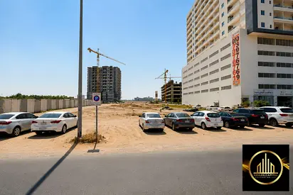 Residential and commercial plot (G+35) for sale, on the corner of two streets in Al-Amir, behind Tower Fam; freehold