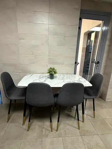 Modern marble-top dining table with 4 grey upholstered chairs with very good condition