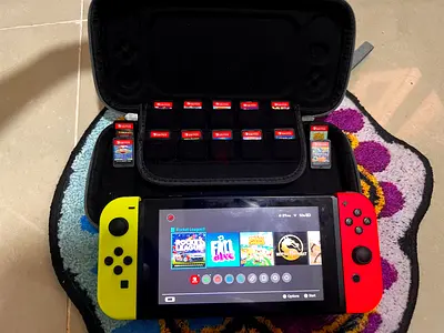 Nintendo Switch (Neon Joy-Con) with game card case - good working condition WITH 14 GAMES
