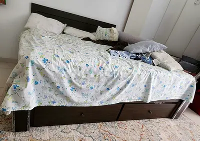 Dark wood double bed with storage drawers - good condition