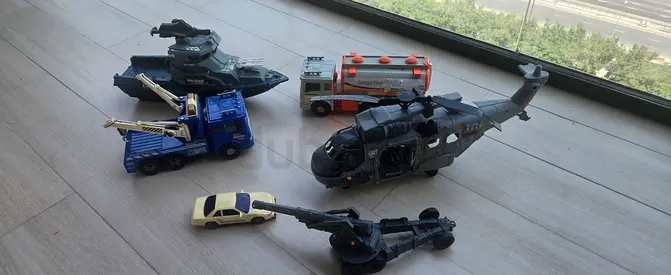 Mixed toy vehicles set — helicopter, tank, trucks and cars (used)
