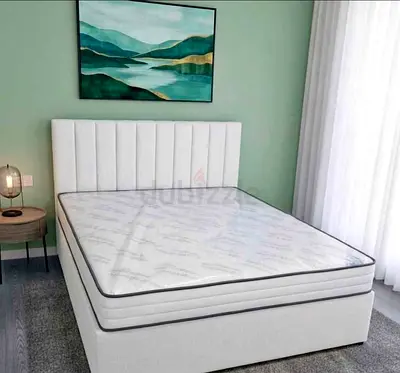New White upholstered King bed with mattress