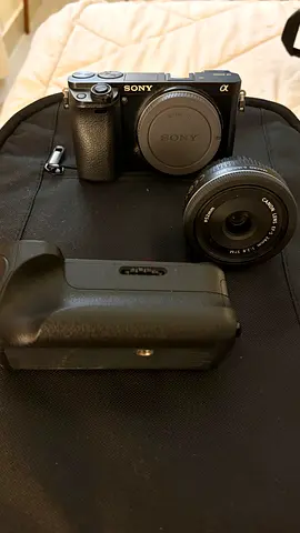 Sony Alpha a6000 Mirrorless Camera with Canon 24mm Lens and Battery Grip
