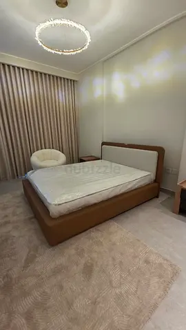A brand new bed with a brand new mattress
