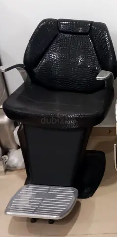 Black salon hairdressing barber chair with footrest — good condition
