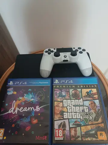 Slim Playstation 4 with one White Dualshock Controller, Controller Charger,  GTA 5 and Dreams Disc