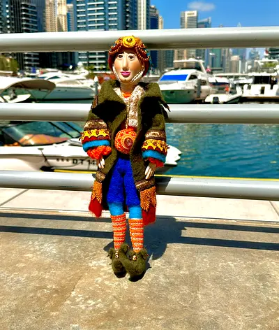 Handmade fabric art doll in colorful folk outfit - collectible