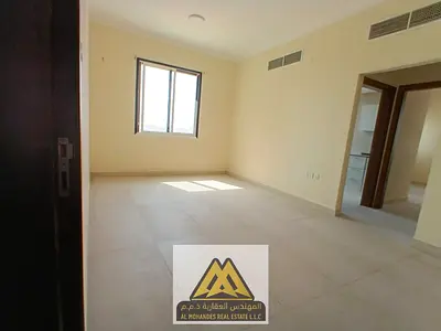 Annual 1-bedroom apartment for rent in Al Alia, Ajman. Balcony, 2 bathrooms, central AC, free maintenance by owner, near Al Bait Al Moutahad, easy acc