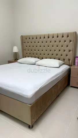 Beige tufted king-size bed