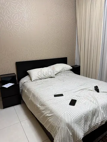 Queen bed frame with mattress and 2 bedside tables - good condition