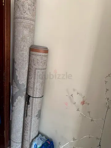 Light grey patterned rolled carpet - good condition, 2 rolls