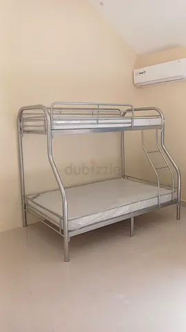 Metal bunk bed with double bottom and single top — good condition