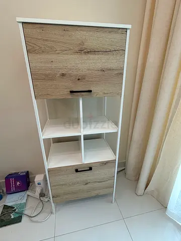 White and wood storage cabinet with shelves