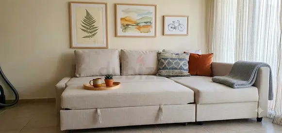 sofa with a practical bed function and built-in storage. The chaise can be configured on either the
