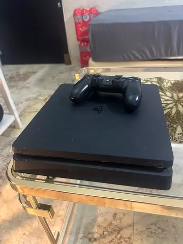 PlayStation 4 Slim console with DualShock 4 controller - good working condition