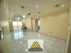 A spacious 2-bedroom apartment is available for sale in Emirates City, Ajman. The apartment offers a